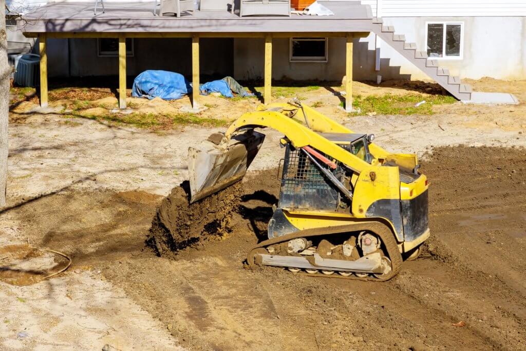 site grading site prep back hoe moving fill dirt