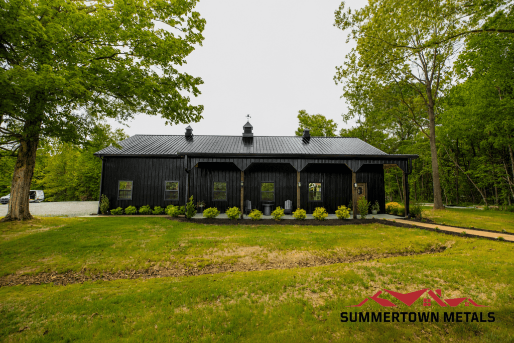 black post frame workshop with sideshed and cupolas