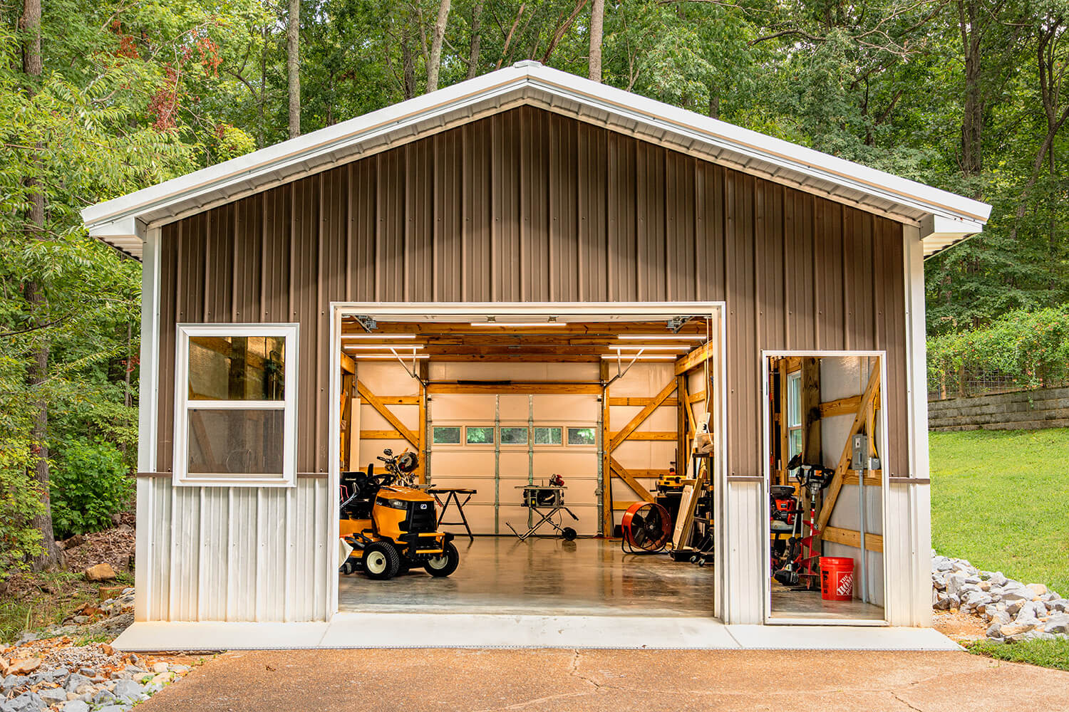 garage with drive through doors showing summer shield metal building insulation inside